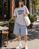 Canada Sorry Dept graphic set sunny model scene with gray tee navy cap natural canvas tote and washed shorts