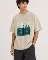 Dollar Drills oversized tee Threadheads-style indoor model close-up, beige colorway