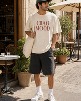 Italy Ciao Mood graphic set sunny model scene with cream tee green cap natural canvas tote and washed shorts