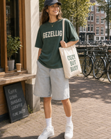 Netherlands Gezellig-ish graphic set sunny model scene with green tee cap natural canvas tote and washed shorts