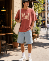 Spain Vale Club graphic set sunny model scene with terracotta tee cap natural canvas tote and washed shorts